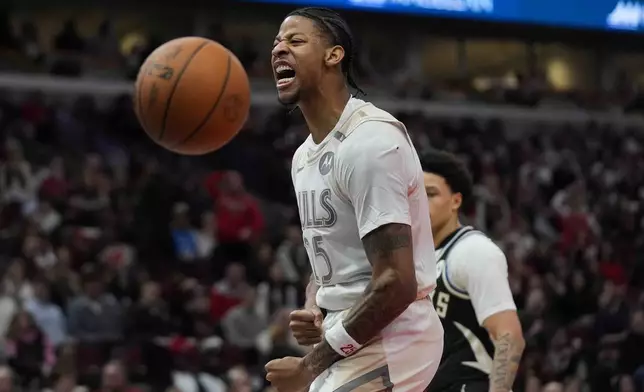 Chicago Bulls forward Dalen Terry reacts after sinking a basket during the second half of an NBA basketball game against the Milwaukee Bucks, Saturday, Dec. 28, 2024, in Chicago. (AP Photo/Erin Hooley)