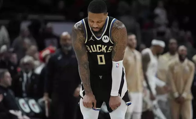 Milwaukee Bucks guard Damian Lillard reacts as his team falls behind the Chicago Bulls during the second half of an NBA basketball game Saturday, Dec. 28, 2024, in Chicago. (AP Photo/Erin Hooley)