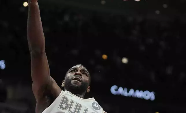 Chicago Bulls forward Patrick Williams goes up to sink a basket during the second half of an NBA basketball game against the Milwaukee Bucks, Saturday, Dec. 28, 2024, in Chicago. (AP Photo/Erin Hooley)