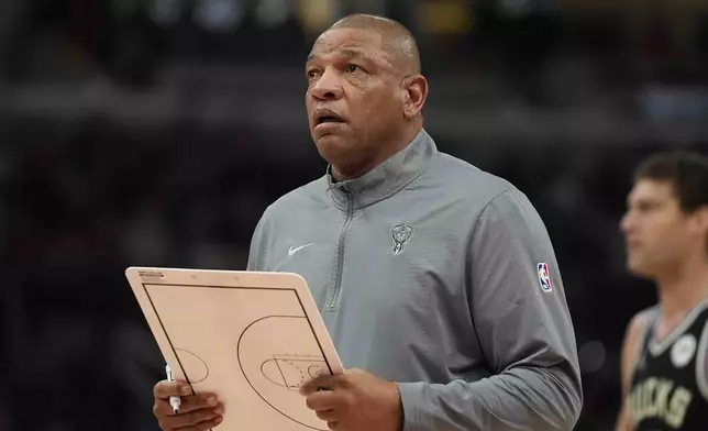 Milwaukee Bucks head coach Doc Rivers prepares for a timeout during the first half of an NBA basketball game against the Chicago Bulls, Saturday, Dec. 28, 2024, in Chicago. (AP Photo/Erin Hooley)