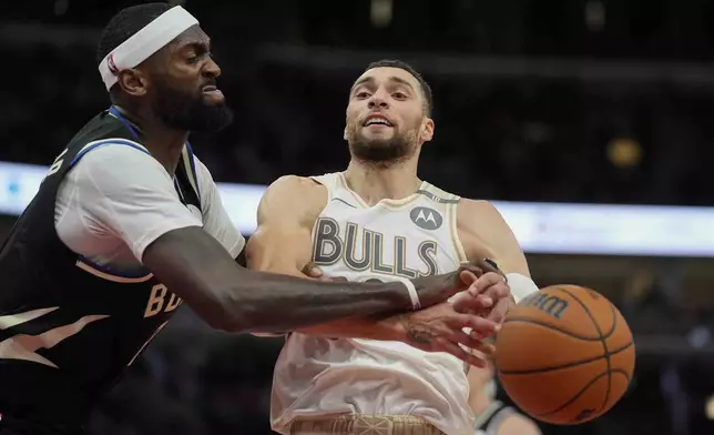 Milwaukee Bucks forward Bobby Portis Jr., left, fouls Chicago Bulls guard Zach LaVine, right, during the second half of an NBA basketball game Saturday, Dec. 28, 2024, in Chicago. (AP Photo/Erin Hooley)