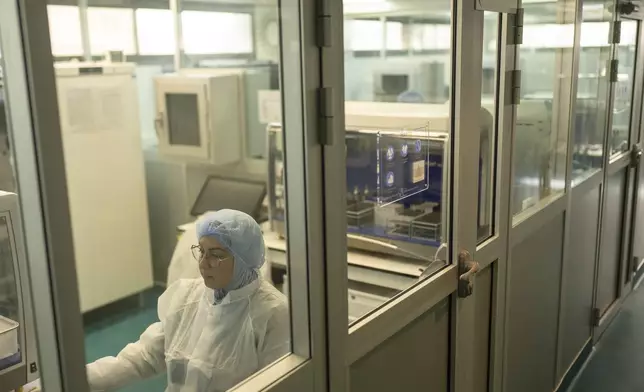 Imane Abdellaoui Maane works in Moldiag, a biotechnology startup, while producing mpox tests, in Tamesna, Morocco, Thursday, Nov. 28, 2024. (AP Photo/Mosa'ab Elshamy)