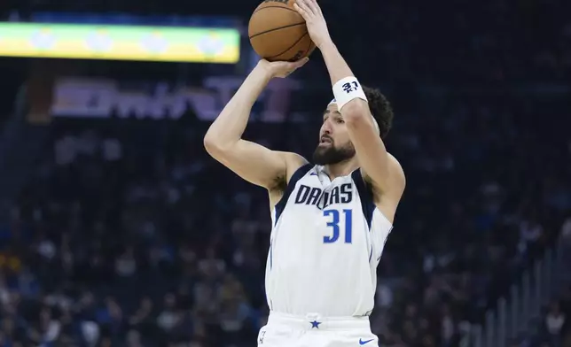 Dallas Mavericks guard Klay Thompson looks to shoot during the first half of an NBA basketball game against the Golden State Warriors, Sunday, Dec. 15, 2024, in San Francisco. (AP Photo/Benjamin Fanjoy)