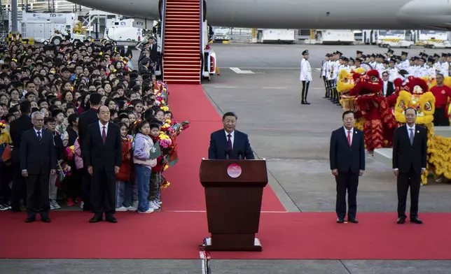 China's President Xi Jinping, center, speaks upon his arrival at the airport in Macao, China, Wednesday, Dec. 18, 2024, ahead of celebrations marking the 25th anniversary of the casino city’s return to Chinese rule. (Eduardo Leal/Pool Photo via AP)