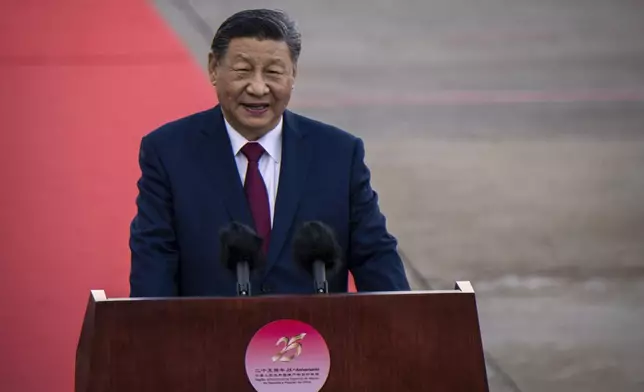 China's President Xi Jinping speaks upon his arrival at the airport in Macao, China, Wednesday, Dec. 18, 2024, ahead of celebrations marking the 25th anniversary of the casino city’s return to Chinese rule. (Eduardo Leal/Pool Photo via AP)