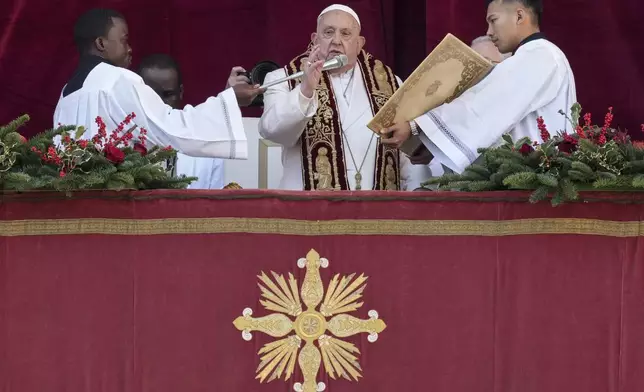 Pope Francis delivers the Urbi et Orbi (Latin for 'to the city and to the world' ) Christmas' day blessing from the main balcony of St. Peter's Basilica at the Vatican, Wednesday, Dec. 25, 2024. (AP Photo/Andrew Medichini)