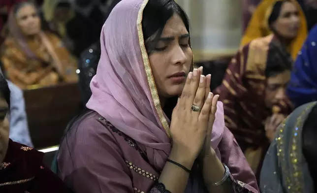 Christians attend the Christmas Mass at Sacred Heart Cathedral Church, in Lahore, Pakistan, Wednesday, Dec. 25, 2024. (AP Photo/K.M. Chaudary)