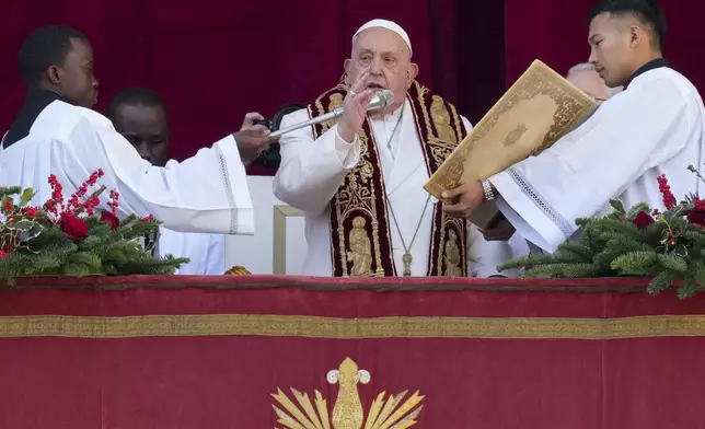 Pope Francis delivers the Urbi et Orbi (Latin for 'to the city and to the world' ) Christmas' day blessing from the main balcony of St. Peter's Basilica at the Vatican, Wednesday, Dec. 25, 2024. (AP Photo/Andrew Medichini)