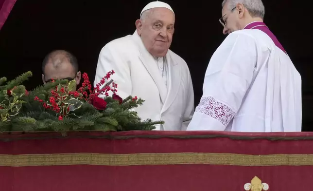 Pope Francis looks on after delivering the Urbi et Orbi (Latin for 'to the city and to the world' ) Christmas' day blessing from the main balcony of St. Peter's Basilica at the Vatican, Wednesday, Dec. 25, 2024. (AP Photo/Andrew Medichini)