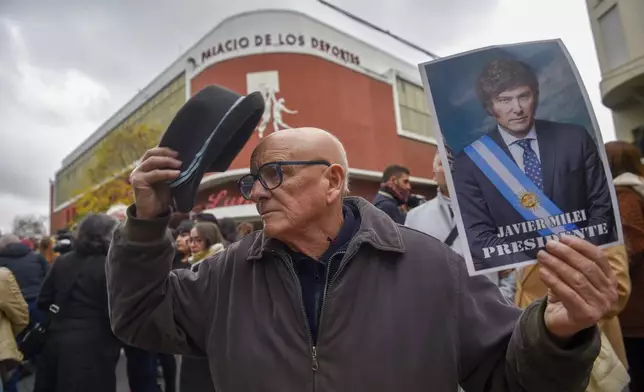 FILE - Supporters of Argentine President Javier Milei arrive at a stadium for the presentation of his book titled "Capitalism, Socialism and the Neoclassical Trap" in Buenos Aires, Argentina, May 22, 2024. (AP Photo/Gustavo Garello, File)