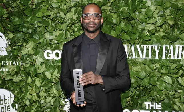 Filmmaker and photographer RaMell Ross poses with the best director award for "Nickel Boys" during The Gothams Film Awards at Cipriani Wall Street on Monday, Dec. 2, 2024, in New York. (Photo by Evan Agostini/Invision/AP)