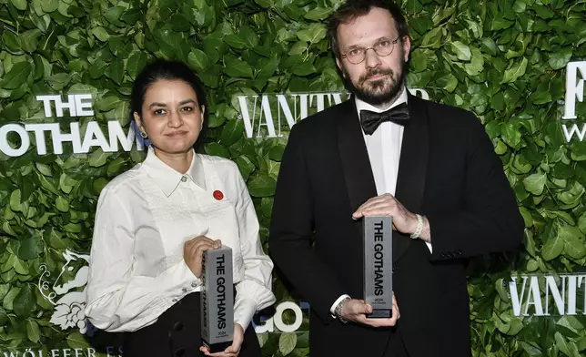 Indian filmmaker Payal Kapadia, left, and producer Thomas Hakim pose with the best international feature award for "All We Imagine as Light" during The Gothams Film Awards at Cipriani Wall Street on Monday, Dec. 2, 2024, in New York. (Photo by Evan Agostini/Invision/AP)