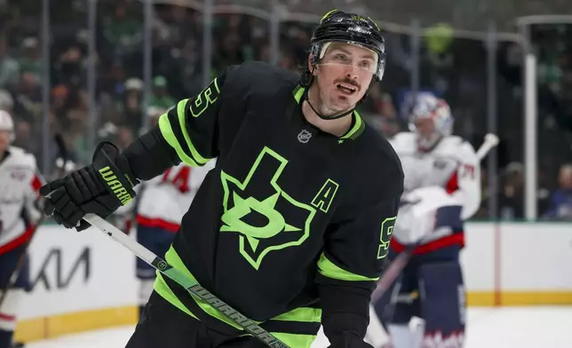 Dallas Stars center Matt Duchene (95) skates after shooting on goal during the first period of an NHL hockey game against the Washington Capitals in Dallas, Monday, Dec. 16, 2024. (AP Photo/Gareth Patterson)