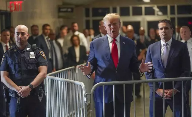 Former President Donald Trump speaks before entering the courtroom at Manhattan criminal court, Thursday, Feb. 15, 2024, in New York. (AP Photo/Mary Altaffer)