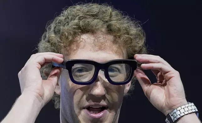 Mark Zuckerberg wears a pair of Orion AR glasses during the Meta Connect conference Wednesday, Sept. 25, 2024, in Menlo Park, Calif. (AP Photo/Godofredo A. Vásquez)