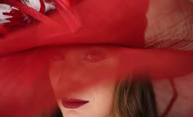 A race fan walks though the stands at Churchill Downs before the 150th running of the Kentucky Derby horse race Saturday, May 4, 2024, in Louisville, Ky. (AP Photo/Brynn Anderson)