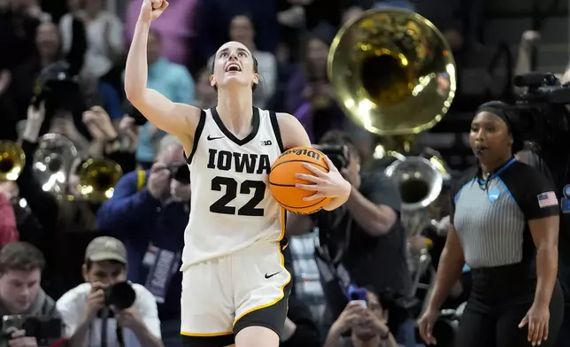 Iowa guard Caitlin Clark (22) celebrates after defeating LSU in an Elite Eight round college basketball game during the NCAA Tournament, Monday, April 1, 2024, in Albany, N.Y. (AP Photo/Mary Altaffer)