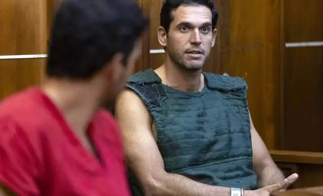 Alon Alexander, 37, right, and his twin brother, Oren, left, attend their bond hearing at the Richard E. Gerstein Justice Building after being charged with multiple state and federal crimes, including sex trafficking and rape, on Friday, Dec. 13, 2024, in Miami. (Matias J. Ocner/Miami Herald via AP, Pool)