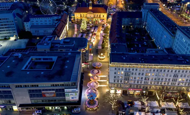 The Christmas market, where a car drove into a crowd on Friday evening, in Magdeburg, Germany, is empty on Saturday evening , Dec. 21, 2024. (AP Photo/Michael Probst)