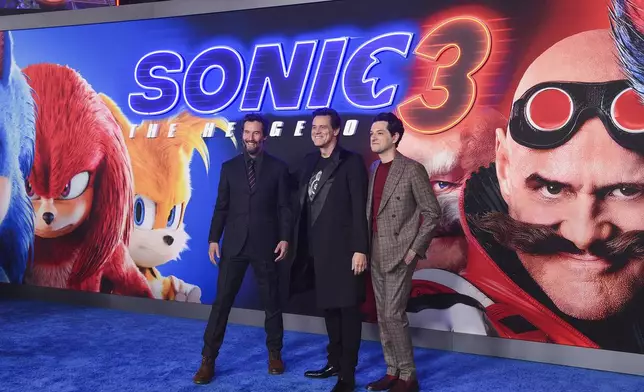 Keanu Reeves, from left, Jim Carrey, and Ben Shwartz arrive at the premiere of "Sonic The Hedgehog 3" on Monday, Dec. 16, 2024, at TCL Chinese Theatre in Los Angeles. (Photo by Richard Shotwell/Invision/AP)