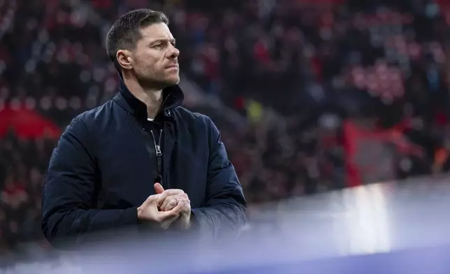 Leverkusen's head coach Xabi Alonso before the German Bundesliga soccer match between Bayer 04 Leverkusen and SC Freiburg in Leverkusen, Germany, Saturday, Dec. 21, 2024. (Marius Becker/dpa via AP)