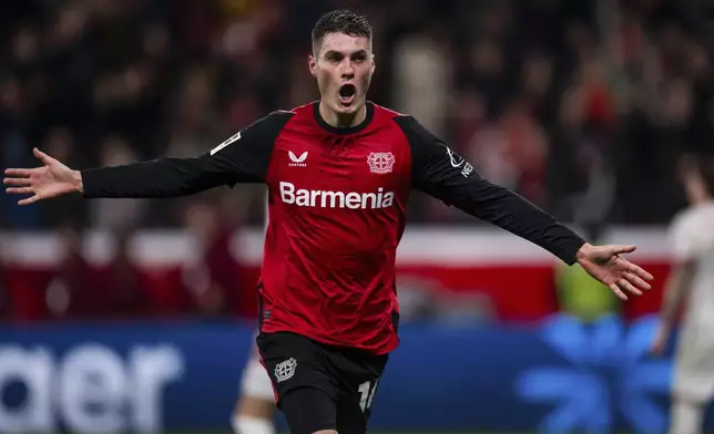 Leverkusen's Patrik Schick celebrates after scoring his side's third goal during the German Bundesliga soccer match between Bayer 04 Leverkusen and SC Freiburg in Leverkusen, Germany, Saturday, Dec. 21, 2024. (Marius Becker/dpa via AP)