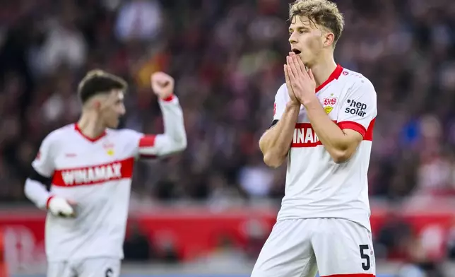 Stuttgart's Yannik Keitel, right, reacts during the German Bundesliga soccer match between VfB Stuttgart and FC St. Pauli, in Stuttgart, Germany, Saturday, Dec. 21, 2024. (Tom Weller/dpa via AP)