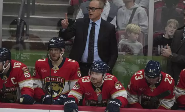 Florida Panthers head coach Paul Maurice gestures during the second period of an NHL hockey game against the Carolina Hurricanes, Saturday, Nov. 30, 2024, in Sunrise, Fla. (AP Photo/Marta Lavandier)