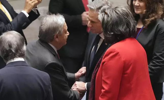 U.S. Secretary of State Antony Blinken, center, talks with UN Secretary General Antonio Guterres, left, and US Ambassador Linda Thomas-Greenfield, right, in the United Nations Security Council, Thursday, Dec. 19, 2024. (AP Photo/Richard Drew)