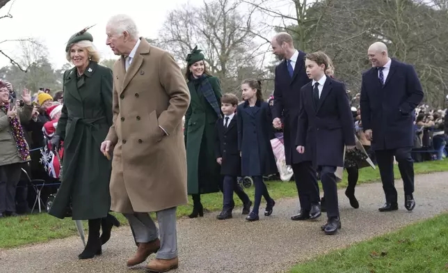 Britain's King Charles IIIt, second left, with Queen Camilla, Kate Princess of Wales, Prince Louis, Princess Charlotte, Prince William, Prince George and at right Mike Tindall arrive for the Christmas day service at St Mary Magdalene Church in Sandringham in Norfolk, England, Wednesday, Dec. 25, 2024. (AP Photo/Jon Super)