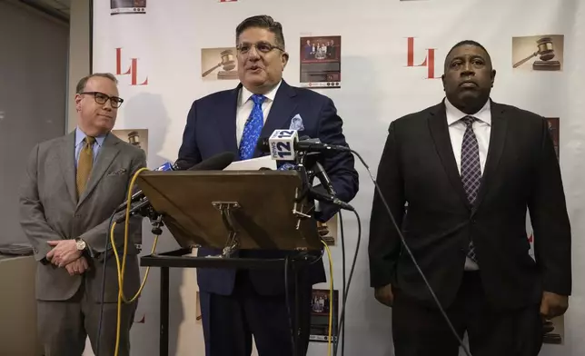 Former NYPD Chief of Department Jeffrey Maddrey, right, and attorney Lambros Lambrou, center, attend a press conference, Friday, Dec. 27, 2024, in New York. (AP Photo/Yuki Iwamura)