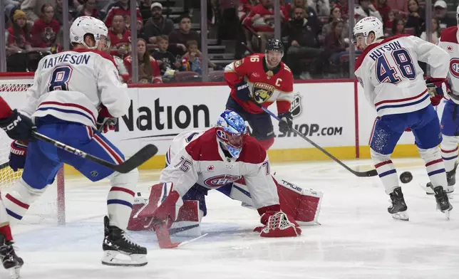 Montreal Canadiens goaltender Jakub Dobes (75) defends the goal during the second period of an NHL hockey game against the Florida Panthers, Saturday, Dec. 28, 2024, in Sunrise, Fla. (AP Photo/Lynne Sladky)