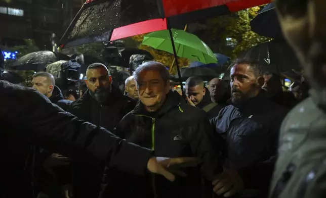 Opposition leader Sali Berisha joins his supporters during an anti-government protest, after he was released from the house arrest, asking for a technocratic caretaker Cabinet, in Tirana, Albania, Monday, Dec. 23, 2024. (AP Photo/Vlasov Sulaj)