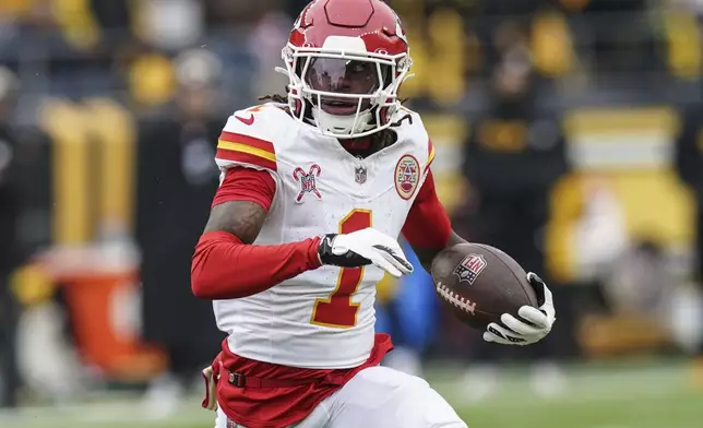 Kansas City Chiefs wide receiver Xavier Worthy (1) runs against the Pittsburgh Steelers during the first half of an NFL football game, Wednesday, Dec. 25, 2024, in Pittsburgh. (AP Photo/Matt Freed)