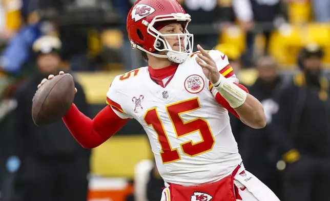 Kansas City Chiefs quarterback Patrick Mahomes (15) passes against the Pittsburgh Steelers during the first half of an NFL football game, Wednesday, Dec. 25, 2024, in Pittsburgh. (AP Photo/Matt Freed)