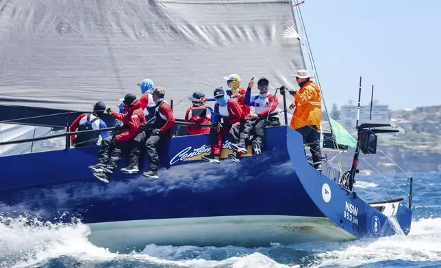 In this photo provided by Salty Dingo, Philippines entry Centennial sails towards the heads after the start of the Sydney to Hobart yacht race in Sydney, Thursday, Dec. 26, 2024. (Salty Dingo via AP)