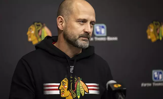 Chicago Blackhawks interim head coach Anders Sorensen speaks to reporters after NHL hockey practice at Fifth Third Arena, Friday, Dec. 6, 2024. (Ashlee Rezin/Chicago Sun-Times via AP)