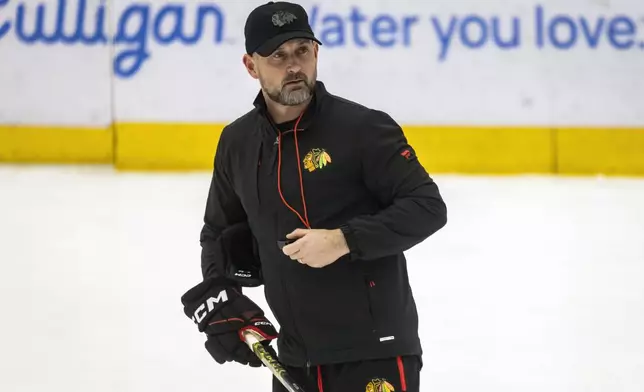 Chicago Blackhawks interim head coach Anders Sorensen skates during NHL hockey practice at Fifth Third Arena, Friday, Dec. 6, 2024. (Ashlee Rezin/Chicago Sun-Times via AP)