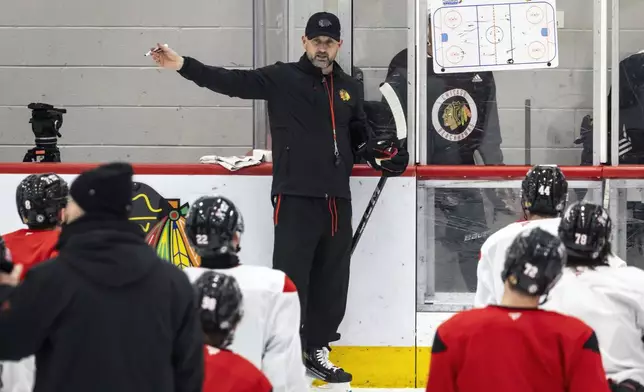 Chicago Blackhawks interim head coach Anders Sorensen directs players during NHL hockey practice at Fifth Third Arena, Friday, Dec. 6, 2024. (Ashlee Rezin/Chicago Sun-Times via AP)