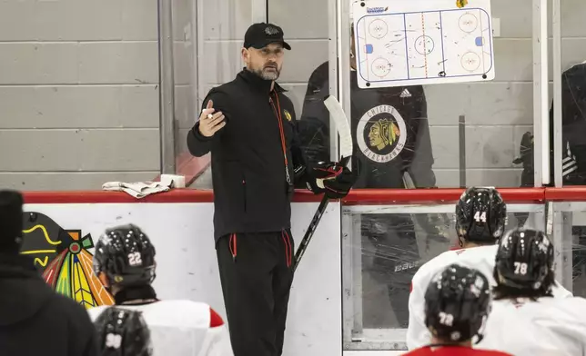 Chicago Blackhawks interim head coach Anders Sorensen directs players during NHL hockey practice at Fifth Third Arena, Friday, Dec. 6, 2024. (Ashlee Rezin/Chicago Sun-Times via AP)
