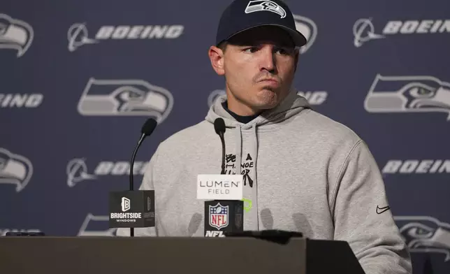 Seattle Seahawks head coach Mike Macdonald answers questions during a press conference after an NFL football game against the Minnesota Vikings, Sunday, Dec. 22, 2024, in Seattle. The Vikings won 27-24. (AP Photo/Lindsey Wasson)