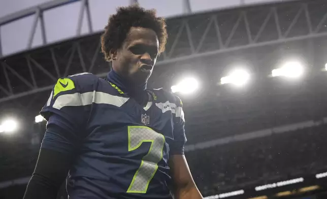 Seattle Seahawks quarterback Geno Smith (7) walks off the field after the 27-24 loss to the Minnesota Vikings of an NFL football game, Sunday, Dec. 22, 2024, in Seattle. (AP Photo/Lindsey Wasson)