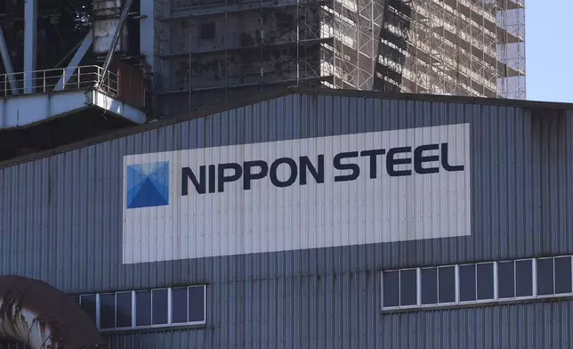 Logo of Nippon Steel on the exterior of Blast Furnace No. 1 at the company's Kashima Plant in Kashima, Japan on Friday, Dec. 6, 2024. (AP Photo/Ayaka McGill)