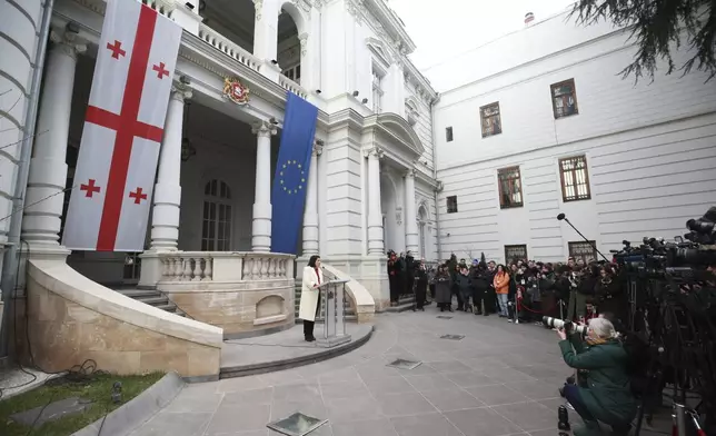 Outgoing Georgian President Salome Zourabichvili holds a press conference outside the Orbeliani Palace, the official residence of the President of Georgia, in Tbilisi, Georgia, Sunday, Dec. 29, 2024. (AP Photo/Zurab Tsertsvadze)