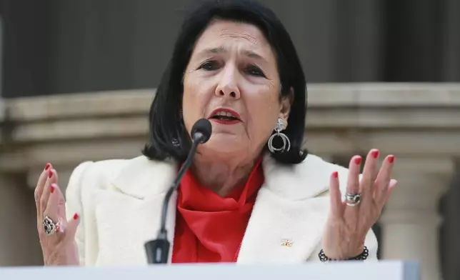 Outgoing Georgian President Salome Zourabichvili holds a press conference outside the Orbeliani Palace, the official residence of the President of Georgia, in Tbilisi, Georgia, Sunday, Dec. 29, 2024. (AP Photo/Zurab Tsertsvadze)