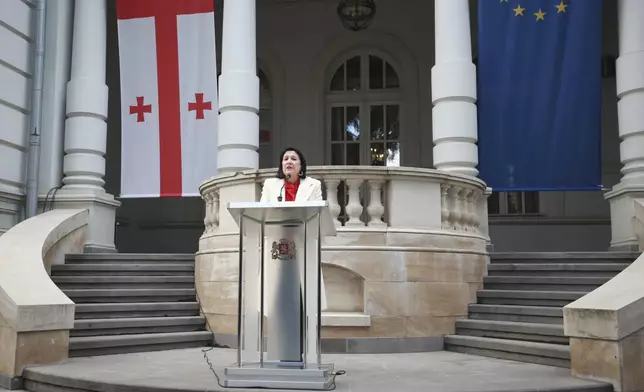 Outgoing Georgian President Salome Zourabichvili holds a press conference outside the Orbeliani Palace, the official residence of the President of Georgia, in Tbilisi, Georgia, Sunday, Dec. 29, 2024. (AP Photo/Zurab Tsertsvadze)