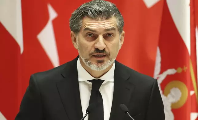 Georgian President-elect Mikheil Kavelashvili speaks at his swearing-in ceremony at the Georgian Parliament in Tbilisi, Georgia, Sunday, Dec. 29, 2024. (Irakli Gedenidze/Pool Photo via AP)