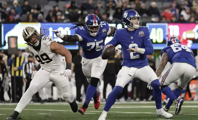 New York Giants quarterback Drew Lock (2) passes against the New Orleans Saints during the fourth quarter of an NFL football game, Sunday, Dec. 8, 2024, in East Rutherford, N.J. (AP Photo/Adam Hunger)