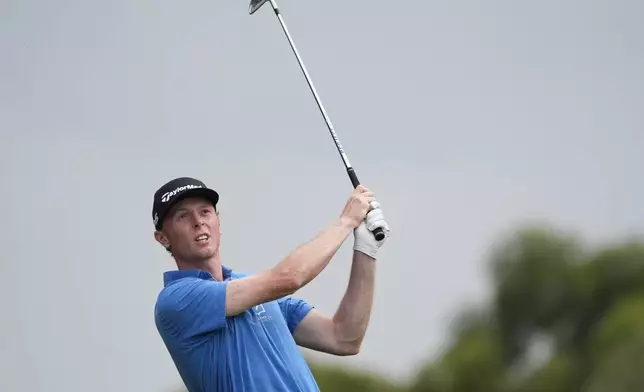 Ryggs Johnston of the United States watches his shot into the 18th green during the final round of the Australian Open golf championship at the Kingston Heath Golf Club in Melbourne, Australia, Sunday, Dec. 1, 2024. (AP Photo/Asanka Brendon Ratnayake)