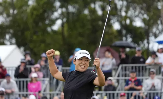 Jiyai Shin of Korea reacts on the 18th green after winning the Australian Open women's golf championship at the Kingston Heath Golf Club in Melbourne, Australia, Sunday, Dec. 1, 2024. (AP Photo/Asanka Brendon Ratnayake)